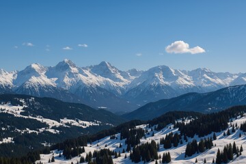 A stunning wide-angle shot of snow-capped mountains under a clear, sunny sky