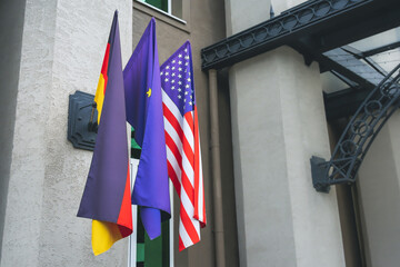 Flag of Germany, United States of America and European Union on a flagpole