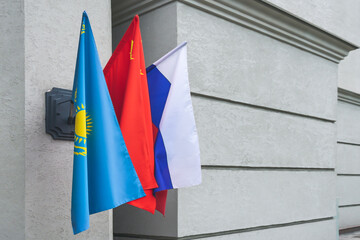 Flag of Kazakhstan, China and Russia on a flagpole