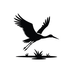 Naklejka premium A minimalist black and white silhouette illustration of a flying stork against a white background