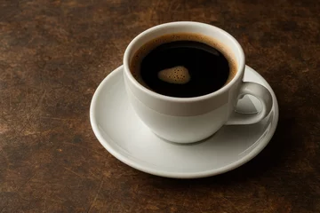  Dark coffee served on a vintage surface © AkuAku