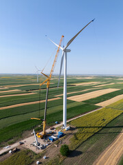 Wind turbine installation using a large construction crane. The assembly process of the turbine...