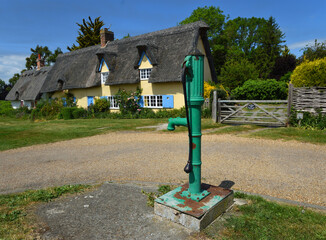Village water pump and cottages at Barrington Cambridgeshire 