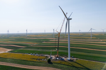 Wind turbine installation using a large construction crane. The assembly process of the turbine...