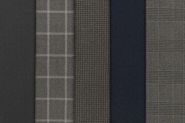 Detailed view of fabric pattern choices for men's trouser backgrounds, with no individuals present.