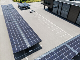 Aerial view of parking space with solar canopies