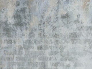 Faded Weathered Wall with Abstract Marks and Scratches. Close-up of a faded, weathered wall with...