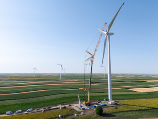 Wind turbine installation using a large construction crane. The assembly process of the turbine...