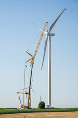Wind turbine installation using a large construction crane. The assembly process of the turbine...