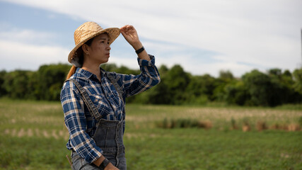 Woman in Straw Hat Enjoys Peaceful Farm Landscape