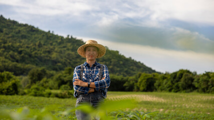 Farmer Stands Confidently in Lush Green Field