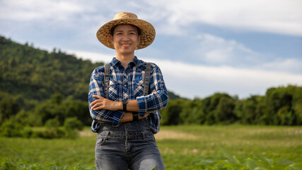 Smiling Farmer Poses Confidently in Green Field