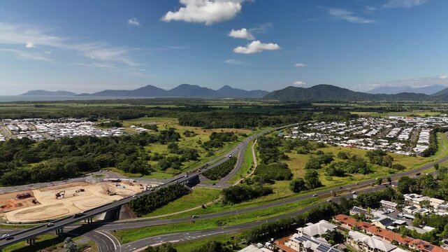 Smithfield, Cairns, Queensland, Australia 4K Aerial Footage Showing Highway, Smithfield Bypass, Road Infrastructure, Residential Suburbs, Construction Zone, Farmland, and Mountain Ranges in Tropical