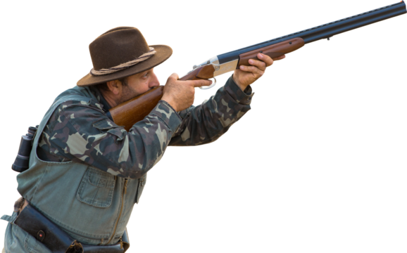 Silhouette of a hunter with a gun in the reeds against the sun, an ambush for ducks with dogs