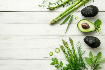 Green Herbs,Asparagus and Black Avocado on a White Wooden Background Top View Flat Lay