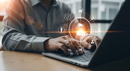 Sleek laptop glows as hands type illuminated by digital icons symbolizing connected business and data analytics on warm