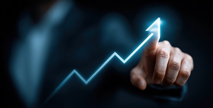 Executive pointing at upward sales graph on virtual interface
 - Powered by Adobe