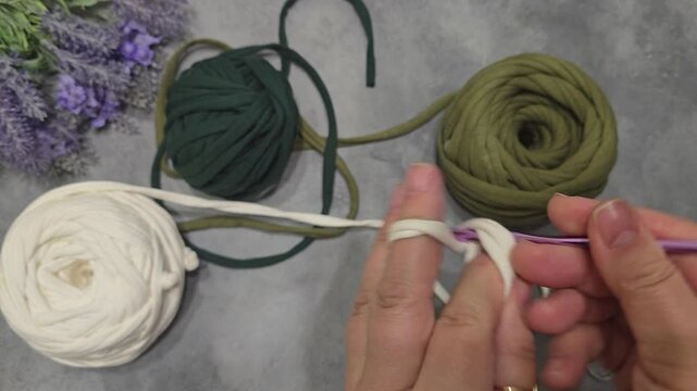 Crochet pattern from knitted ribbons. Different colors in jacquard knitted fabric. Handmade