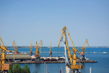 Seaport infrastructure in Odessa, Ukraine. Cargo cranes, terminals and port warehouses on the Black...