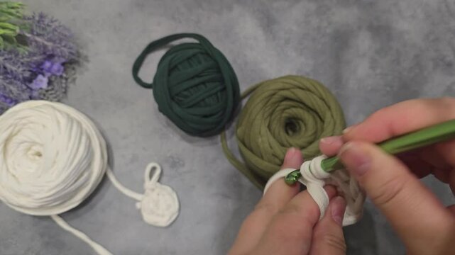 Crochet pattern from knitted ribbons. Different colors in jacquard knitted fabric. Handmade