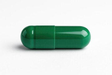 Detailed view of a vibrant green pill against a plain white backdrop