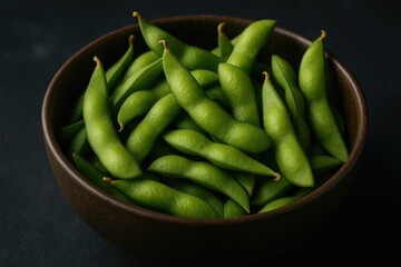 Detailed view of a vintage bowl containing crisp, organic edamame in pods