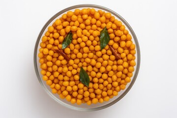 Delicious homemade festival snack featuring crispy spicy chickpea flour balls served in a clear bowl with tea