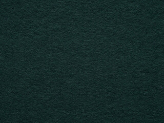 Mystical shades of emerald weave an intricate dance of light and shadow on a dark green backdrop