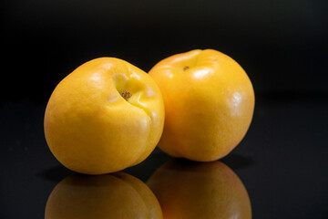 Yellow peach with black background