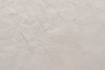 Background featuring recycled white craft paper with a vintage grey paper overlay, showcasing a textured, grunge-style design with creases and rough patterns, ideal for text placement.