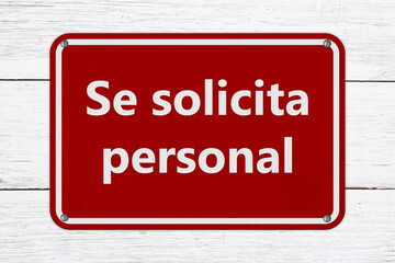 Obraz premium Help Wanted Se solicita personal red sign on weathered wood