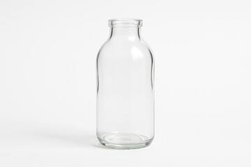 Empty transparent bottle against a plain white backdrop