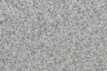 Comprehensive view of a vast, dry, natural grey granite stone surface in full-screen mode
