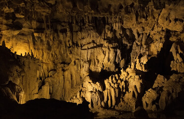 Rock formations of Betharram caves in France during a serene midday excursion