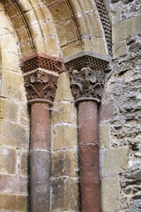 Columns of Abbey Church of Sainte-Foy in Conques, France, intricate stone carvings