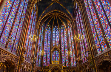 Stained glass windows in Sainte-Chapelle highlight Parisian Gothic architecture