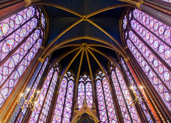Stained glass windows in Sainte-Chapelle highlight Parisian Gothic architecture