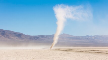 Swirling dust devil in vast desert landscape under clear blue sky, natural phenomenon and weather concept, isolated and dynamic movement.