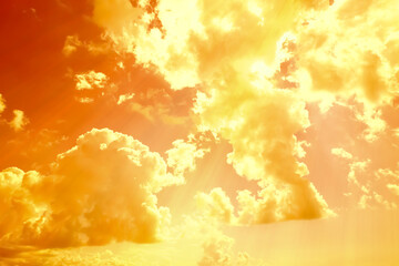 Orange sky with clouds during hot summer weather