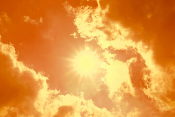 Orange sky with clouds during hot summer weather