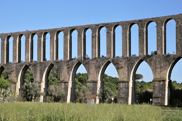 Exploring Pegoes Aqueduct in Portugal's serene landscape