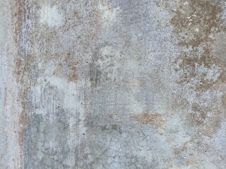 Grunge Weathered Concrete Wall Texture with Rust Stains. Close-up of aged concrete wall showing weathered surface, cracks, and rust stains. Great for backgrounds or grunge texture overlays