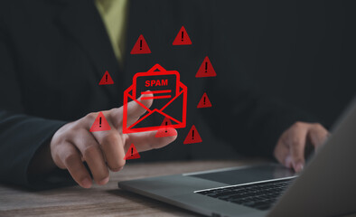 Person pointing at spam email warning icon with red alerts on laptop screen, symbolizing email...