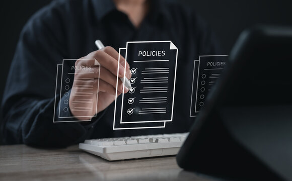 Businessman writing with digital pen on floating policies document interface, symbolizing document management, compliance, checklist procedures, and policy review process in a digital workplace.