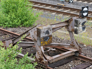 A buffer stop, also known as a buffer weir or buffer, is a form of track termination. It prevents a...