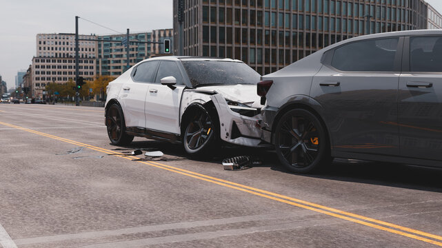 Car crash on city bridge involving modern electric vehicles