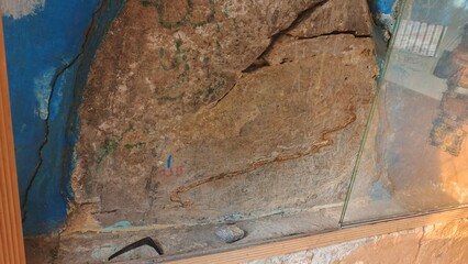Ancient Stone Carving:  Serpentine Petroglyph,  Blue Wall,  Mysterious Mood,  Archaeological Site.