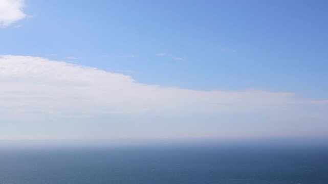 Clouds Clearing Over Sea Timelapse. Moving Clouds Revealing Blue Sky. Coastal Sky Transformation Time Lapse. Morning Sky with Clouds Dissolving