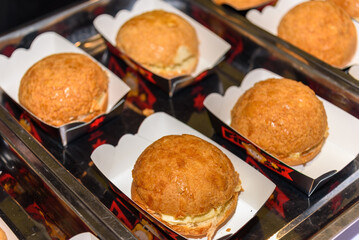 Several boxed of pineapple buns. A classic Cantonese snack.
