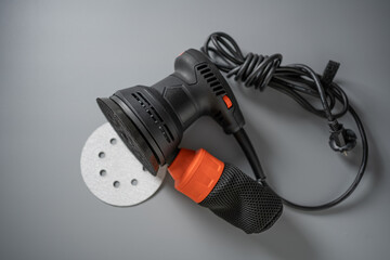 Sanding tool ready for renovation project with ergonomic design and vibrant accents set against a...